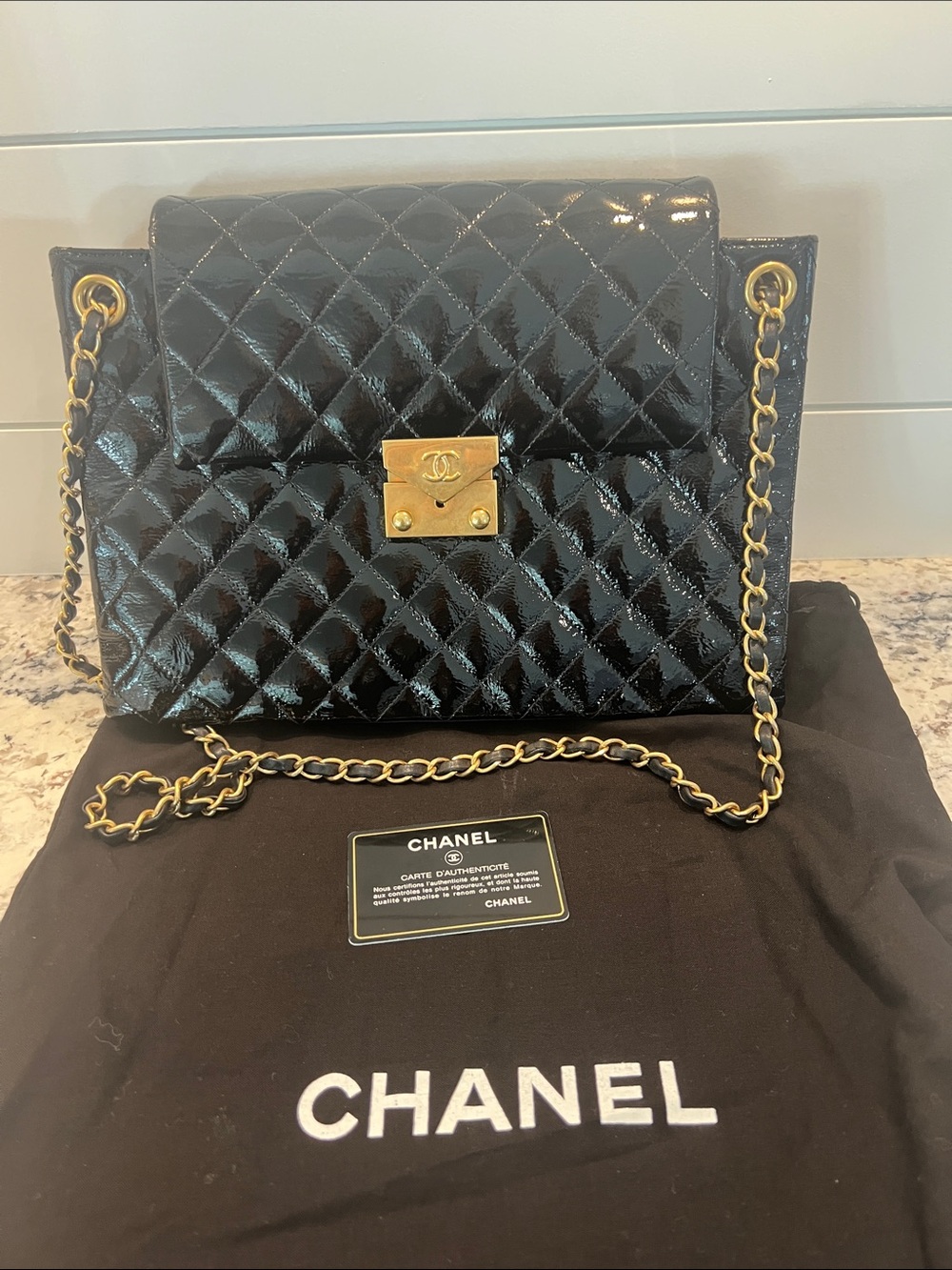 CHANEL Black Quilted Patent Leather Shoulder Bag with Gold Hardware